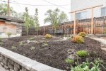 The backyard gardens are growing up fast Our newly landscaped and fully-fenced backyard is perfect for relaxing and  soaking up the sun. A wall of hops provides a peaceful sitting space in the backyard. We also have a shed for you to lock your  toys